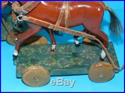 2 chevaux en bois elegant sculptes sur plateforme & roulettes jouet ancien