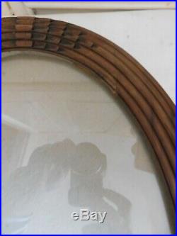 Ancien cadre ovale bois sculpté d'époque art déco avec son verre