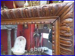 Ancien miroir glace en bois sculpté de godrons epoque XIXe style renaissance