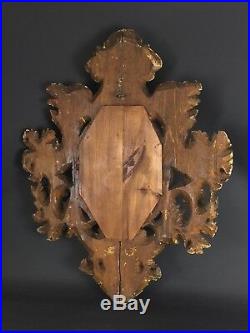 Ancien miroir ovale 18ème en bois sculpté et stuqué doré rocaille Louis XV