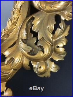Ancien miroir ovale 18ème en bois sculpté et stuqué doré rocaille Louis XV