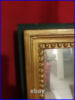 Ancien miroir rectangulaire de style Louis XVI en bois sculpté doré