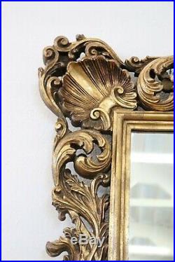 Grand miroir de style baroque ancien en bois sculpté et doré sec. XX