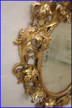Miroir ancien bois sculpté et doré XVIIIème siècle
