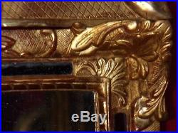 Miroir ancien en bois sculpté et doré feuille d'or d'époque Régence 18ème siècle