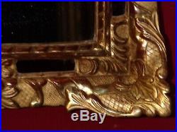 Miroir ancien en bois sculpté et doré feuille d'or d'époque Régence 18ème siècle