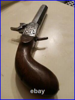 Pistolet ancien du XIXe crosse en bois platine sculptée canon octogonal bel état